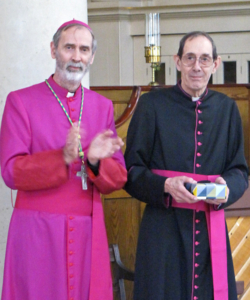 Bishop applauding Mgr Stokes