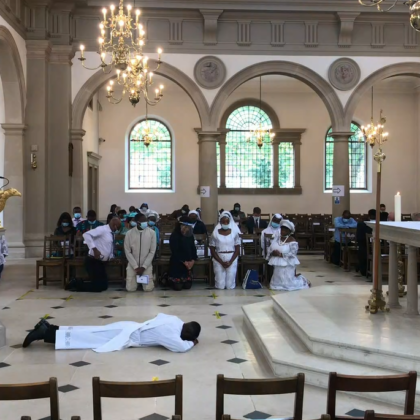 Lying in front of altar