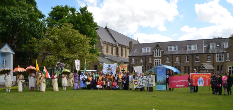 Migrant groups collect outside church