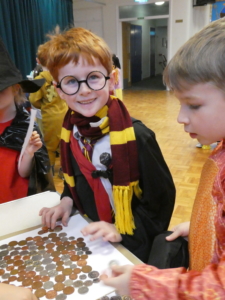 Boy counting funds at St Thomas More
