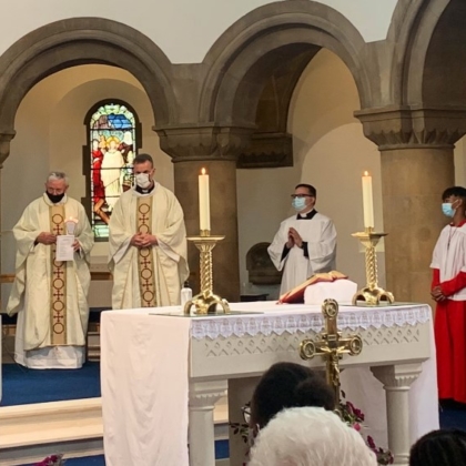 Bishop and clergy in vestments