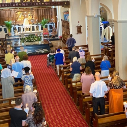 View of aisle with people in pews