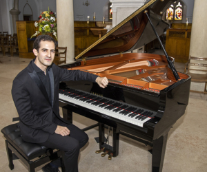 Man seated at piano