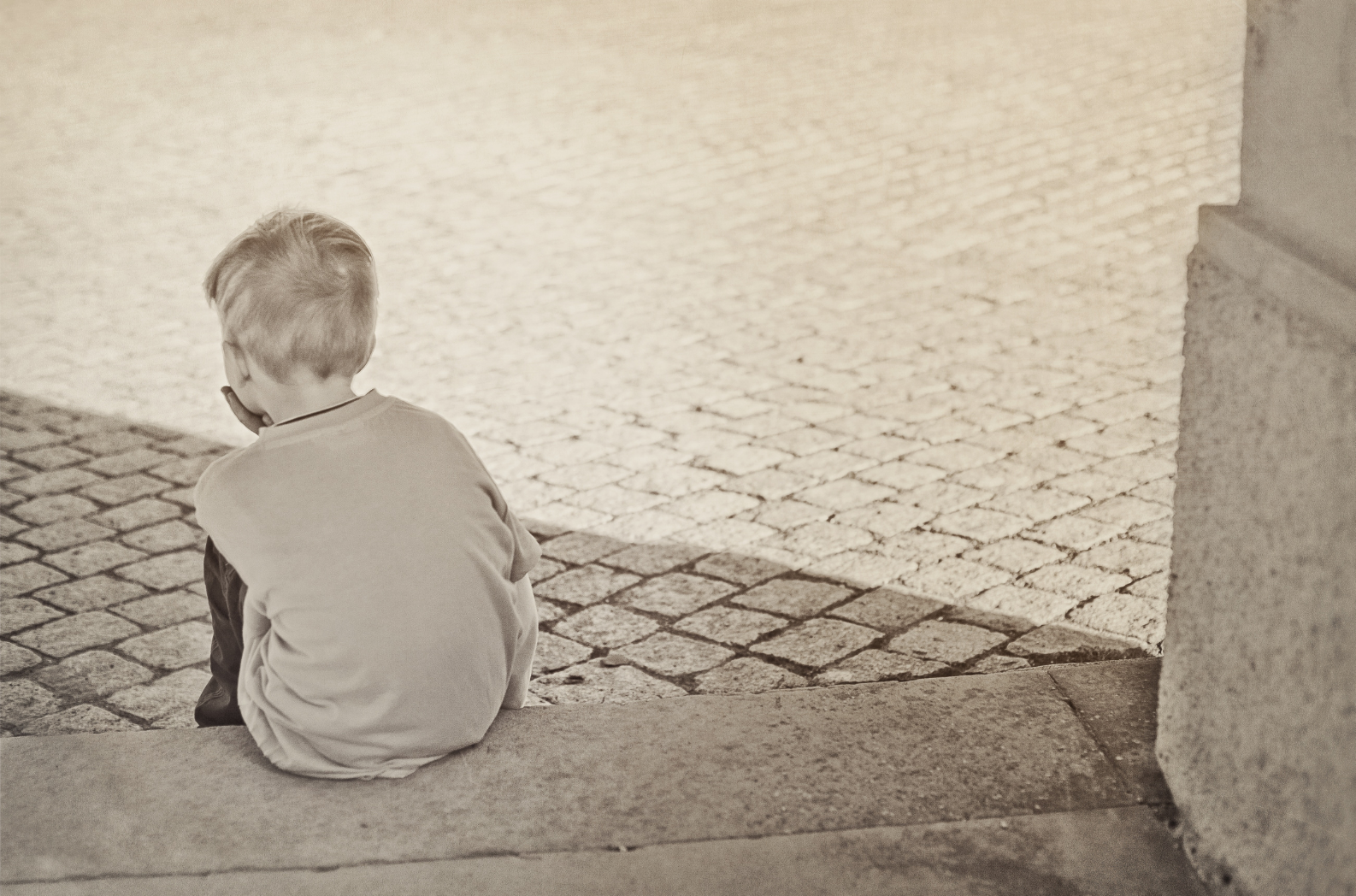 child sitting on step