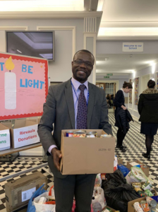 Man holding box of donations