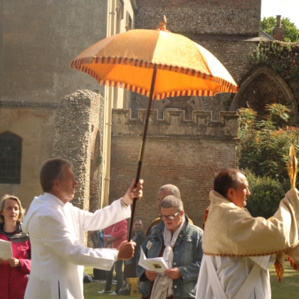 Umbrella held over monstrance