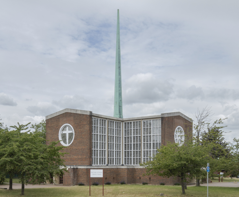 Our Lady of Fatima church with central tall spire viewed from outside