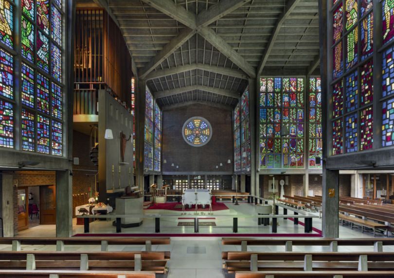 Interior of the church with stained glass windows on all sides