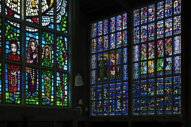 Blue glass panels depicting fifteen mysteries of the Rosary