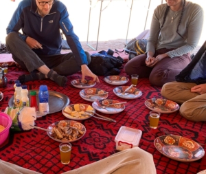 People eating in a tent
