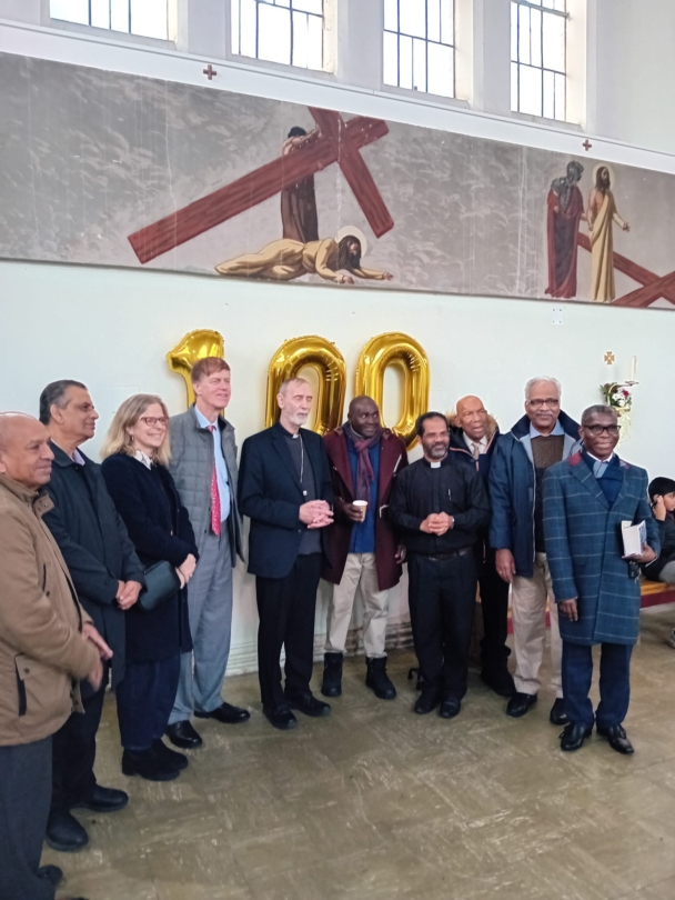 Bishop, Sir Stephen Timms, Fr John with parishioners