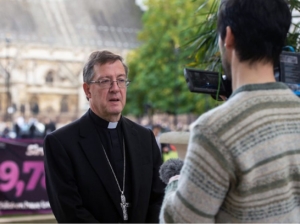 Priest talking 