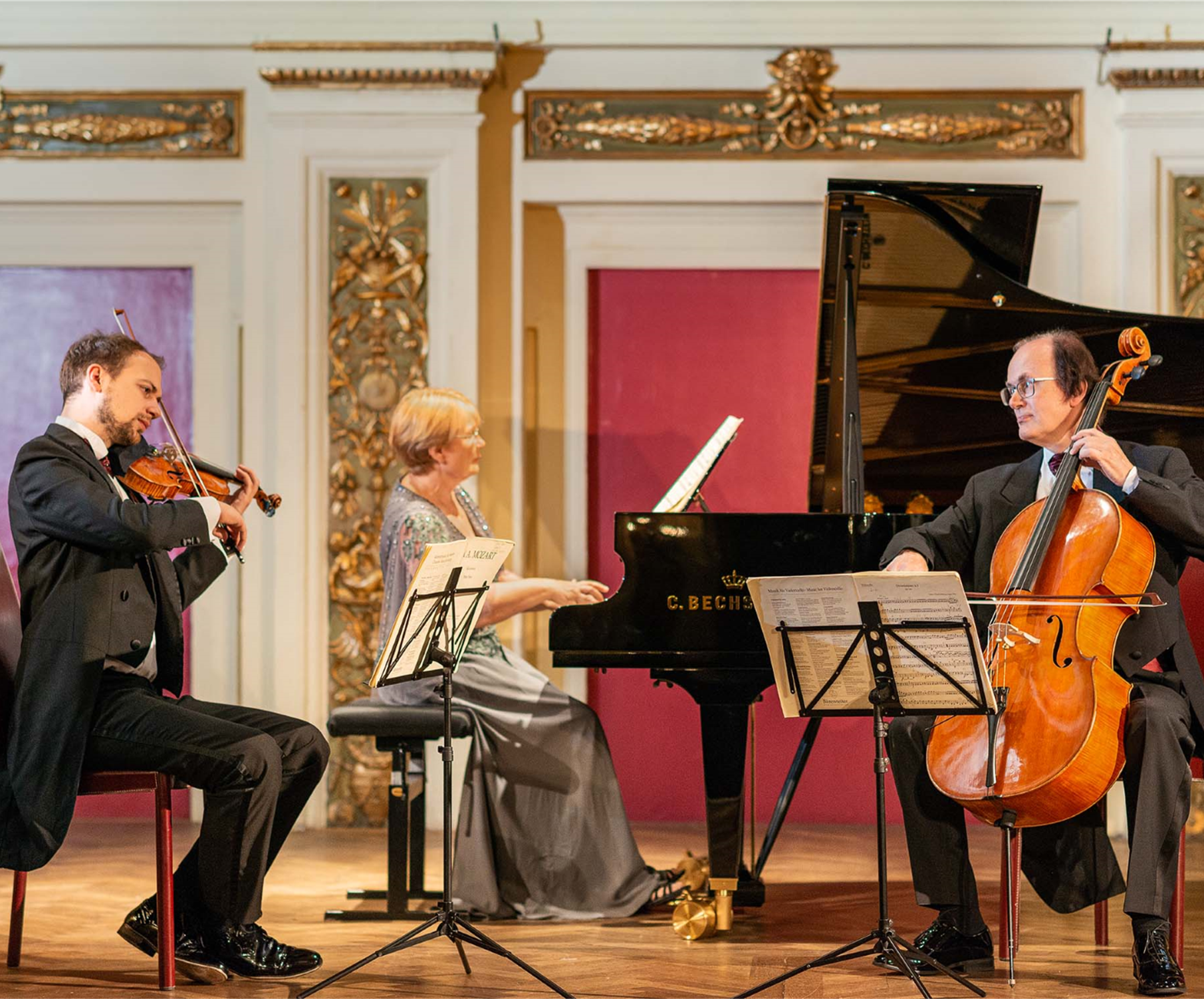 Three people playing instruments