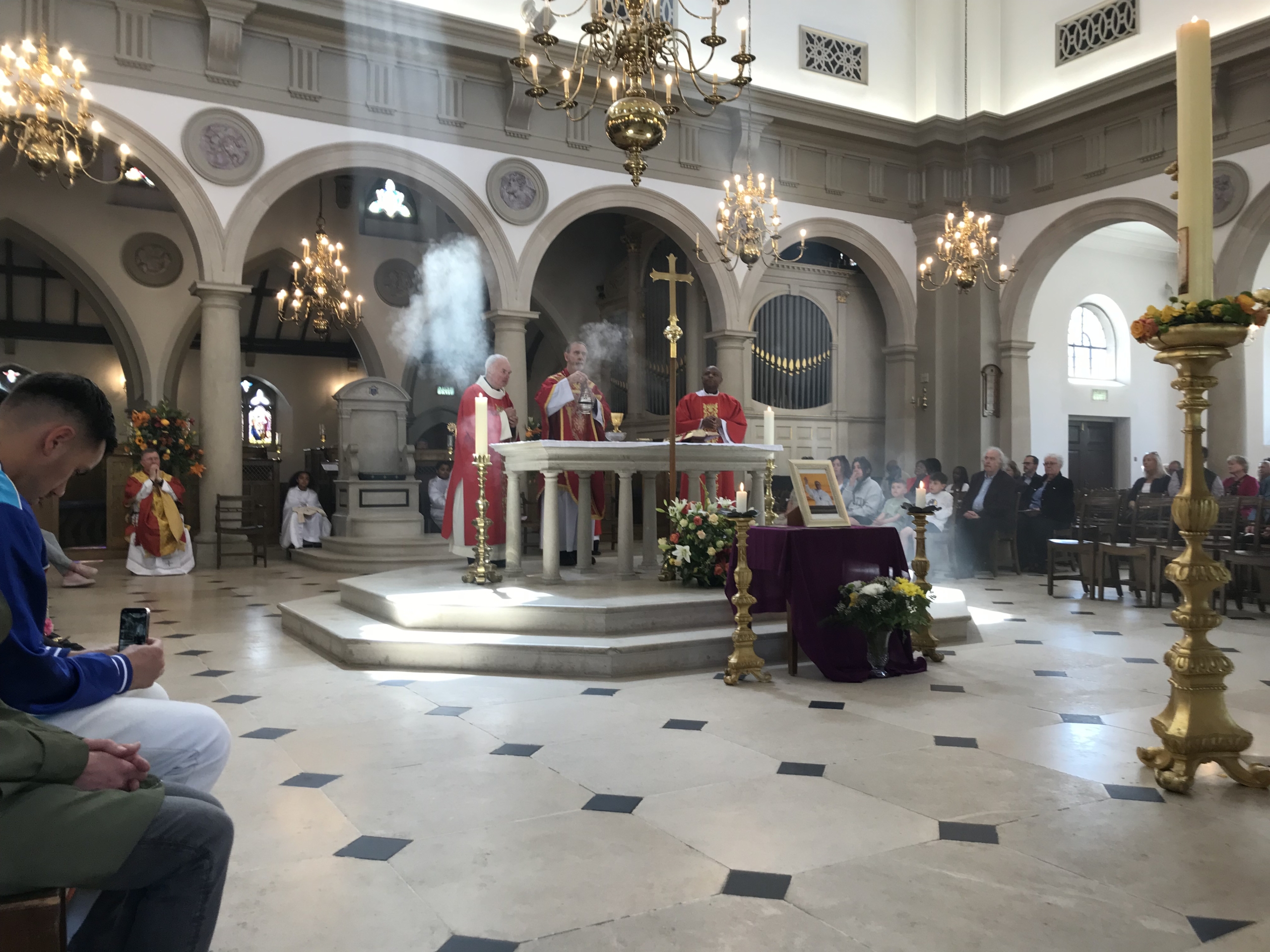 Bishop and deacons at altar