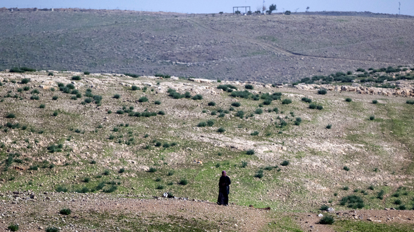 A Bedouin looks across plain